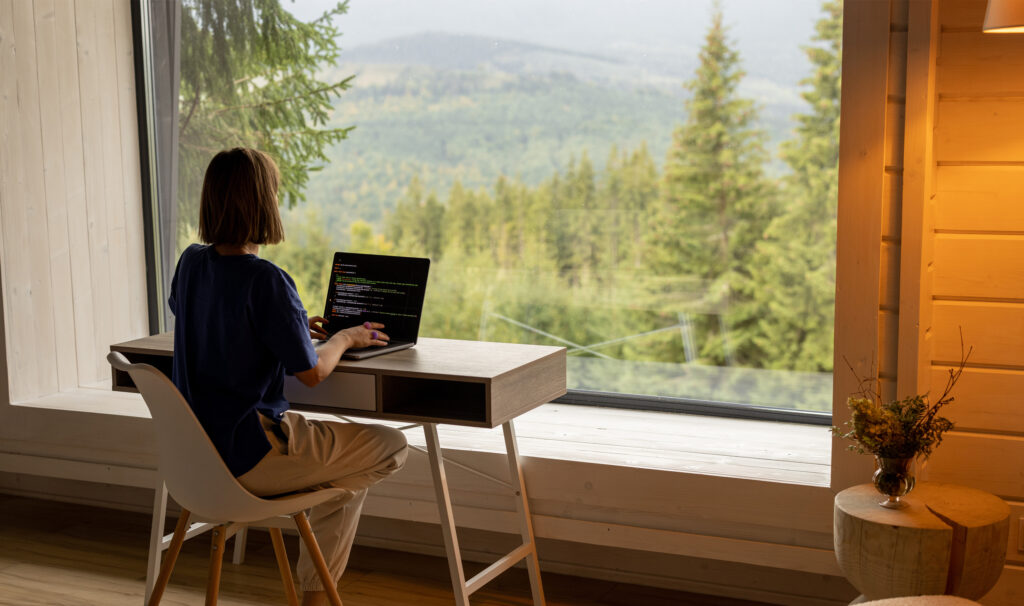 remote worker, working with a landscape of nature/mountains remote worker, working with a landscape of nature/mountains