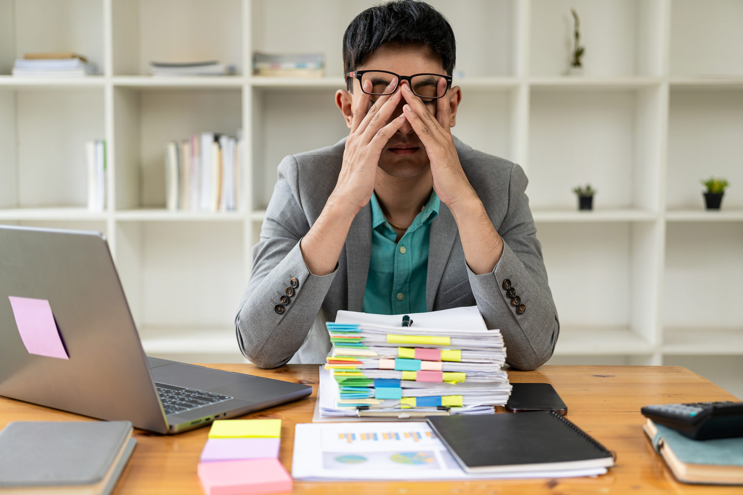 Remote Work - A CEO with a pile of files Remote Work - A CEO with a pile of files