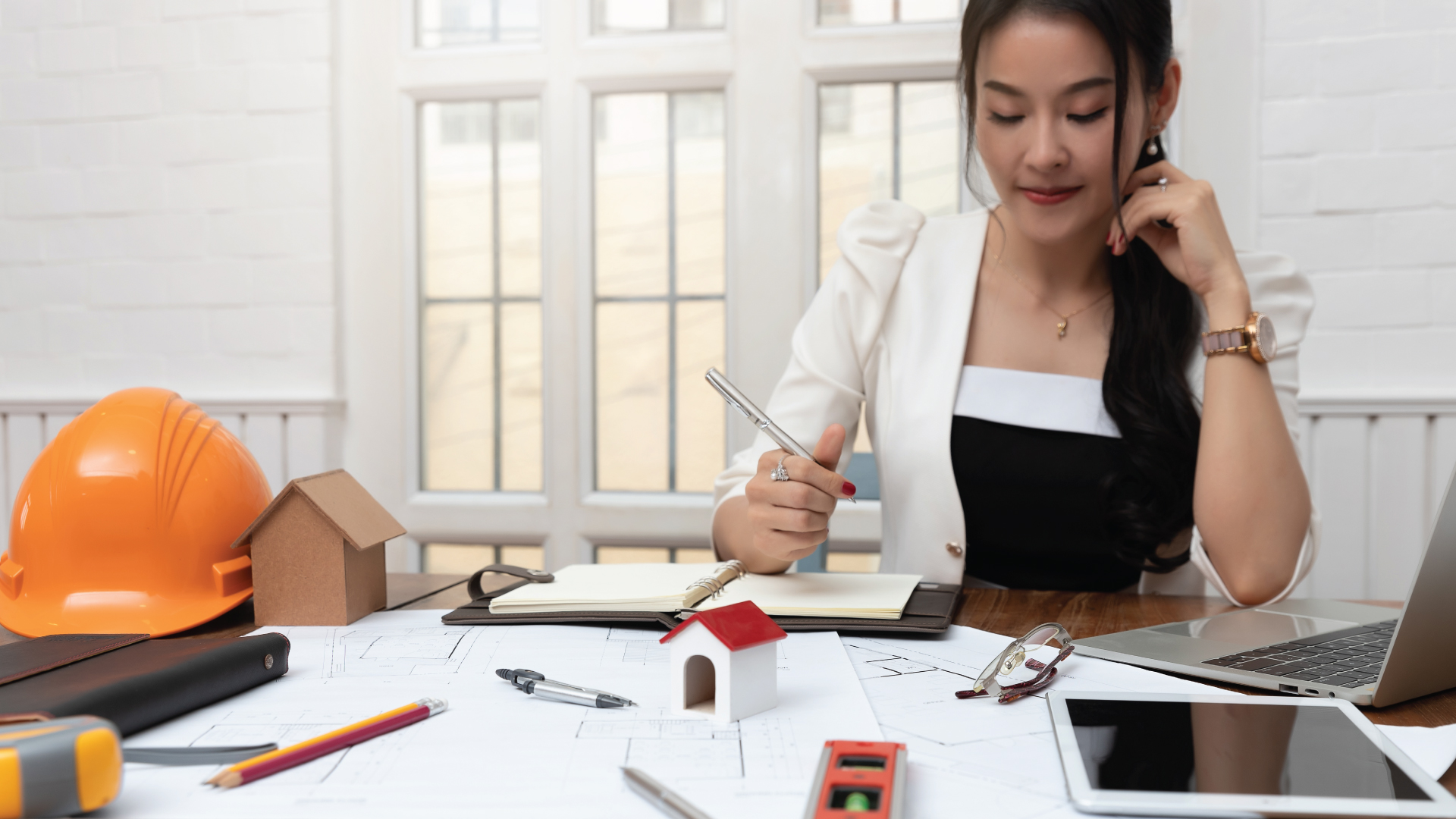 Remote Work -An employee working from home, but with a construction workers’ outfit.
