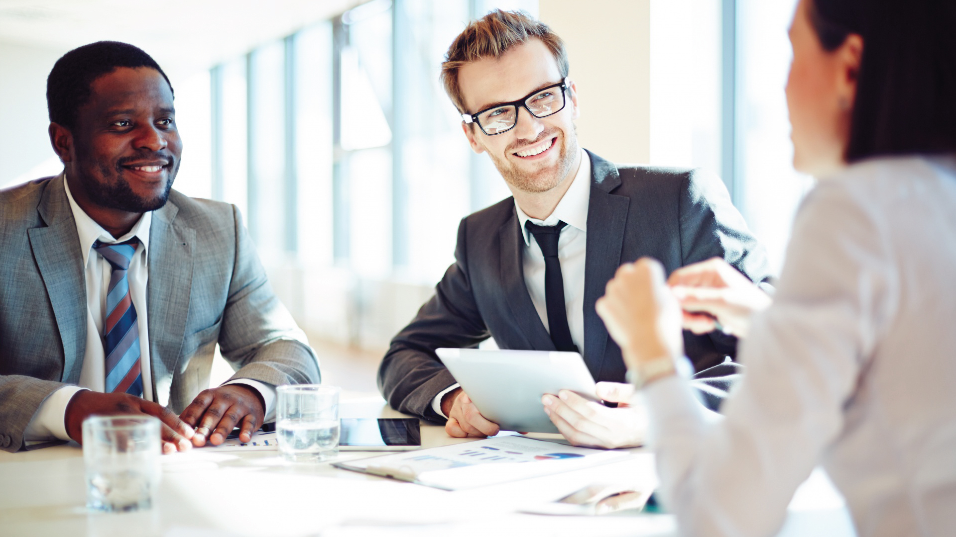 Remote Staffing - Signing of contract between two corporations. All smiles.